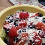 Red WIne Vinegar Dressing Over A Simple Green Salad, With Mozzarella Cheese.